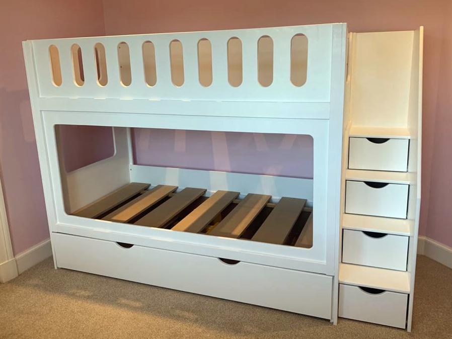 Traditional Joiners Trundle Beds with Oblong cutouts and stair storage